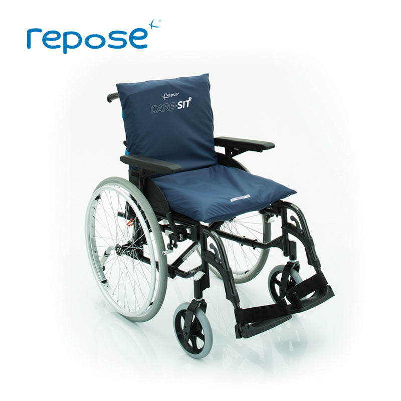 Repose care-sit cushion, with blue cover, placed on a wheelchair to show back and seat in use.