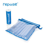 Repose Cushion, inflated, with strap and Repose pump to the side.